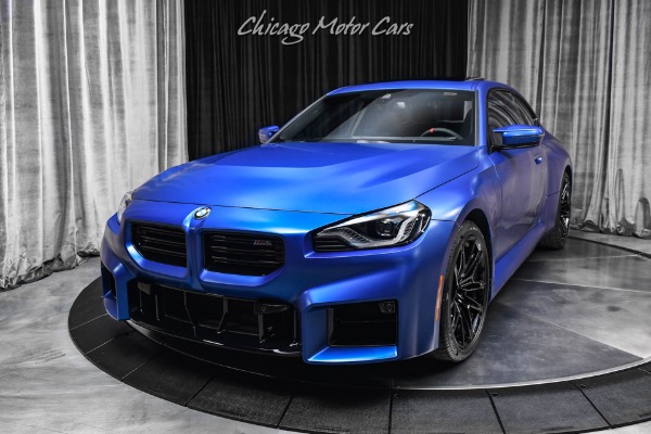 Used 2025 BMW M2 1k Miles 6 Manual Frozen Portimao Blue II Carbon Fiber Trim WARRANTY LOADED for sale Sold at Chicago Motor Cars in West Chicago IL 60185 2