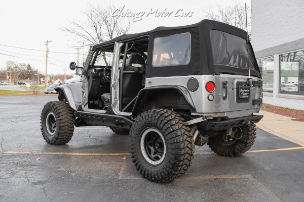 Used-2013-Jeep-Wrangler-Unlimited-Rubicon-4X4-Metallic-Clear-Coat-Exterior-over-Black-Leather-Interior-A-TRUE-ROCK-CRAWLE