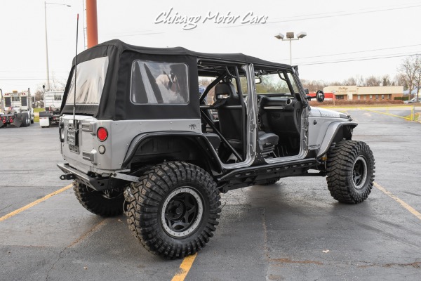 Used-2013-Jeep-Wrangler-Unlimited-Rubicon-4X4-Metallic-Clear-Coat-Exterior-over-Black-Leather-Interior-A-TRUE-ROCK-CRAWLE