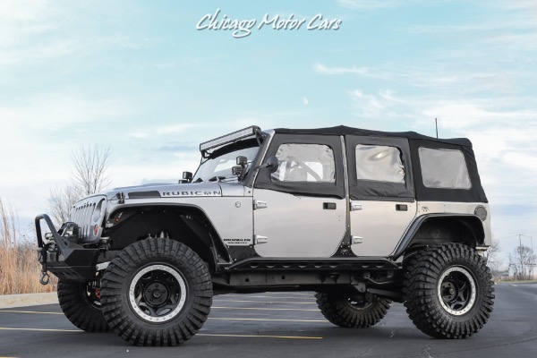 Used 2013 Jeep Wrangler Unlimited Rubicon 4X4 Metallic Clear Coat Exterior over Black Leather Interior A TRUE ROCK CRAWLE for sale Sold at Chicago Motor Cars in West Chicago IL 60185 1