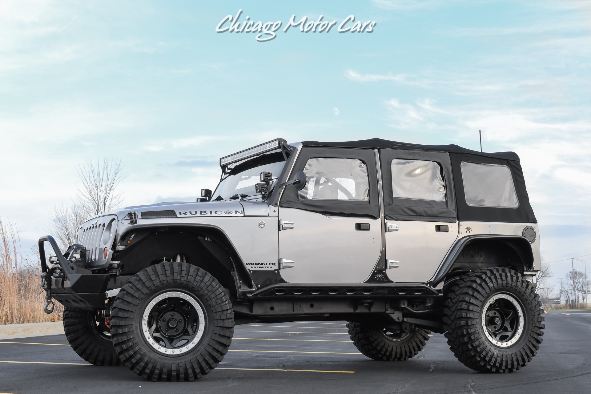 Used 2013 Jeep Wrangler Unlimited Rubicon 4X4 Metallic Clear Coat Exterior over Black Leather Interior A TRUE ROCK CRAWLE for sale Sold at Chicago Motor Cars in West Chicago IL 60185 1